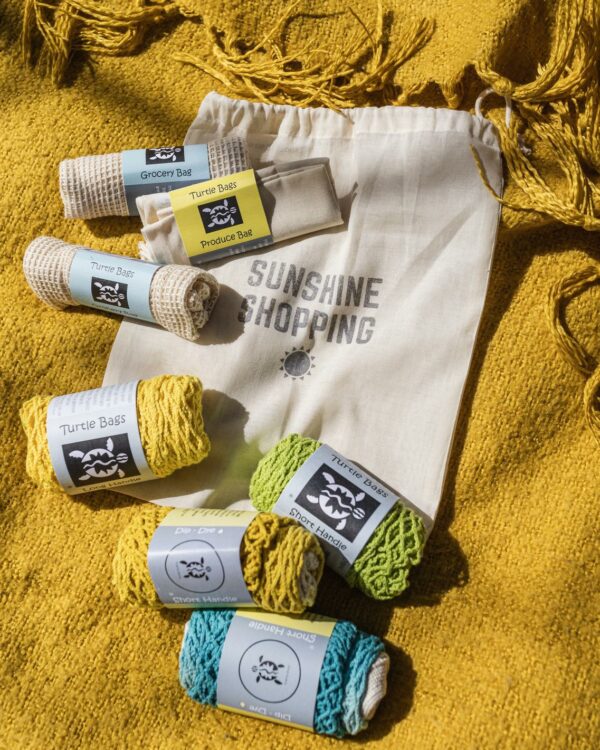 All the sunshine shopping starter kit bags laid out on the drawstring bag